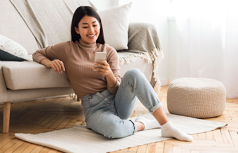 Young woman doing research on her phone